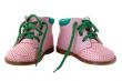 Pink leather baby`s boots.