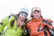 lifestyle image of two young a snowboarders