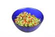 Vegetable Salad in blue salad bowl on white