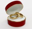 Red 3d casket with two wedding rings
