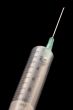 Syringe needle on black