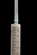 Syringe on black
