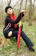 In forest with umbrella