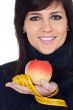 Woman whit apple and measuring tape
