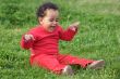 Baby playing on the grass