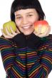A pretty woman holding  apples