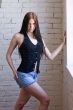hot girl in black top and jean shorts