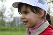 portrait of little girl walking in a park
