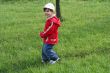 little girl is walking in the park