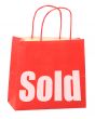 bag with white sold sign