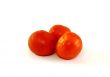 Three juicy red tomatoes close up
