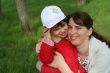 little girl with her mother in the spring park