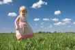 little girl on green meadow