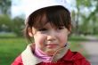 Offended and crying little girl in the park