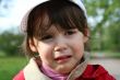 Offended and crying little girl in the park