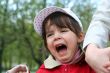 Offended and crying little girl in the park
