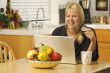 Woman Using Laptop for E-commerce