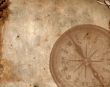 Compass on the old paper