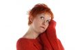 sad red haired woman isolated on white background