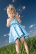 little girl with grass in hands