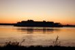 Evening on the river, the ship on sunset