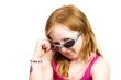 cute girl looking over her sunglasses