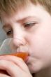 boy drinks tomato juice