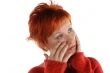 sad red haired woman isolated on white background