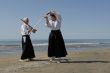 training of Aikido on the beach