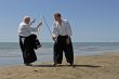 training of Aikido on the beach
