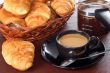 cup of coffee with fresh croissants