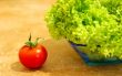 Fresh salad and a  tomato