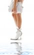 white purse and leather boots with water