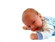 Beautiful kid lays on a stomach
