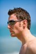 caucasian hunk at the beach with shades