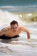 guy getting up from the beach