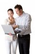A businesswoman and businessman pay attention