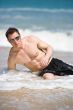 caucasian hunk at the beach with shades