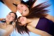 girls having good time together under bright blue sky