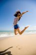 young woman jumping happily