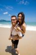 hunk carrying woman piggyback style ath beach