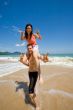 couple playful by the beach