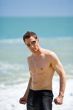 caucasian hunk at the beach with shades