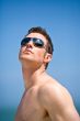 caucasian hunk at the beach with shades