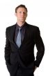 caucasian man smilling wears formal business attire