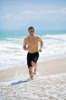 caucasian man running on the beach