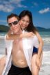 playful couple at the beach