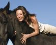 laughing woman and stallion