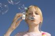 Girl blowing blow bubbles