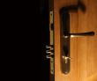 Opened door with lock and key